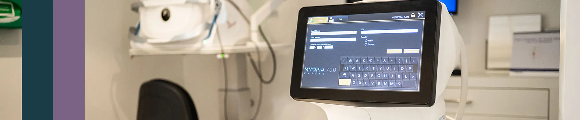 Myopia 700 Expert eye-testing machine with a patient-details touchscreen in an optometry clinic