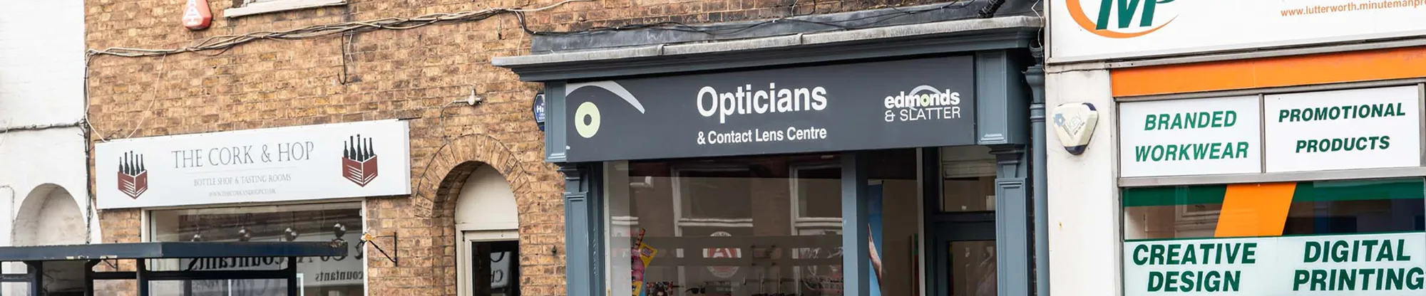 Shopfront of Edmonds & Slatter Opticians in Lutterworth between neighbouring shops