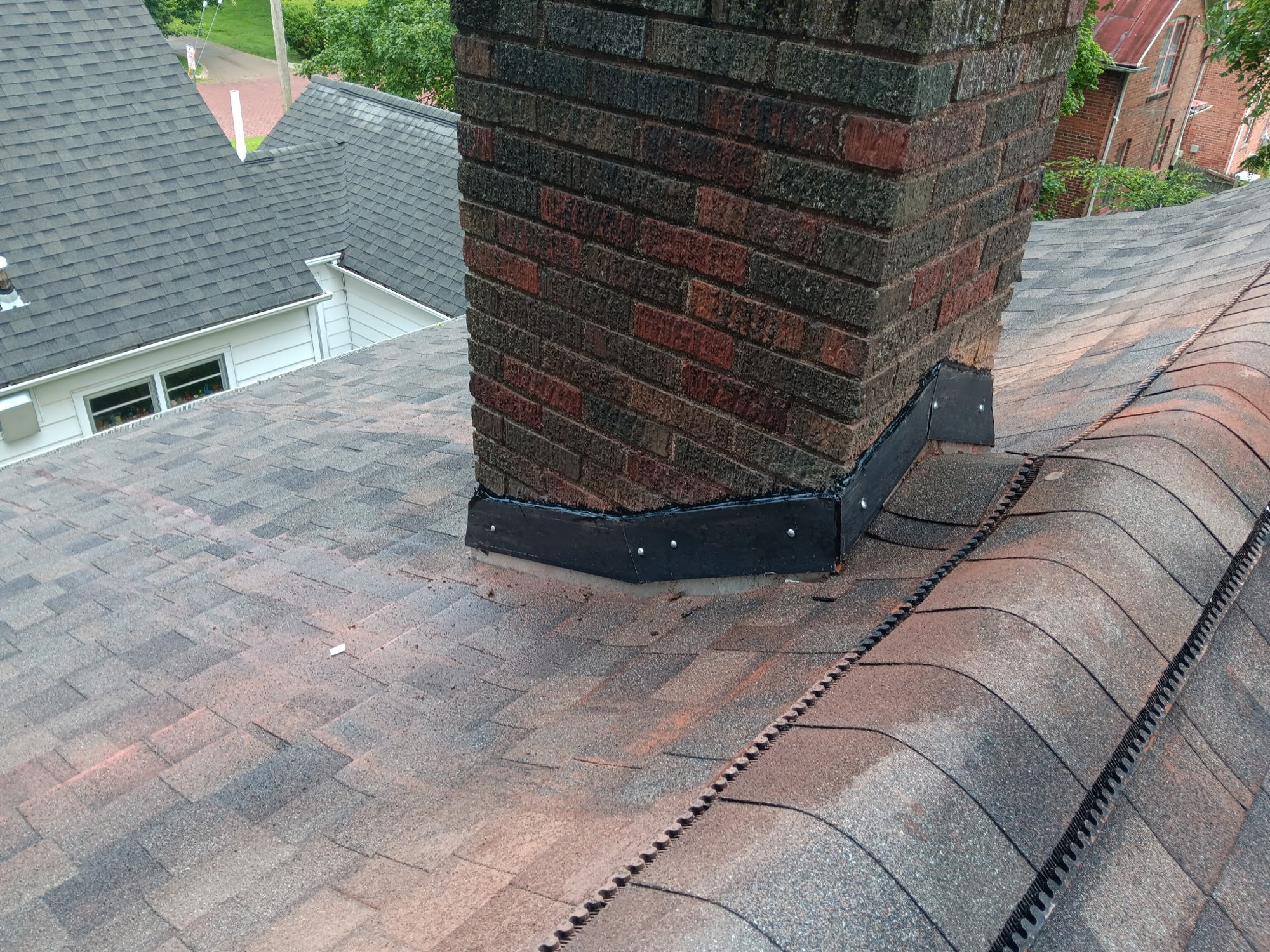 New sealed chimney counterflashing after repair by Impact Exteriors