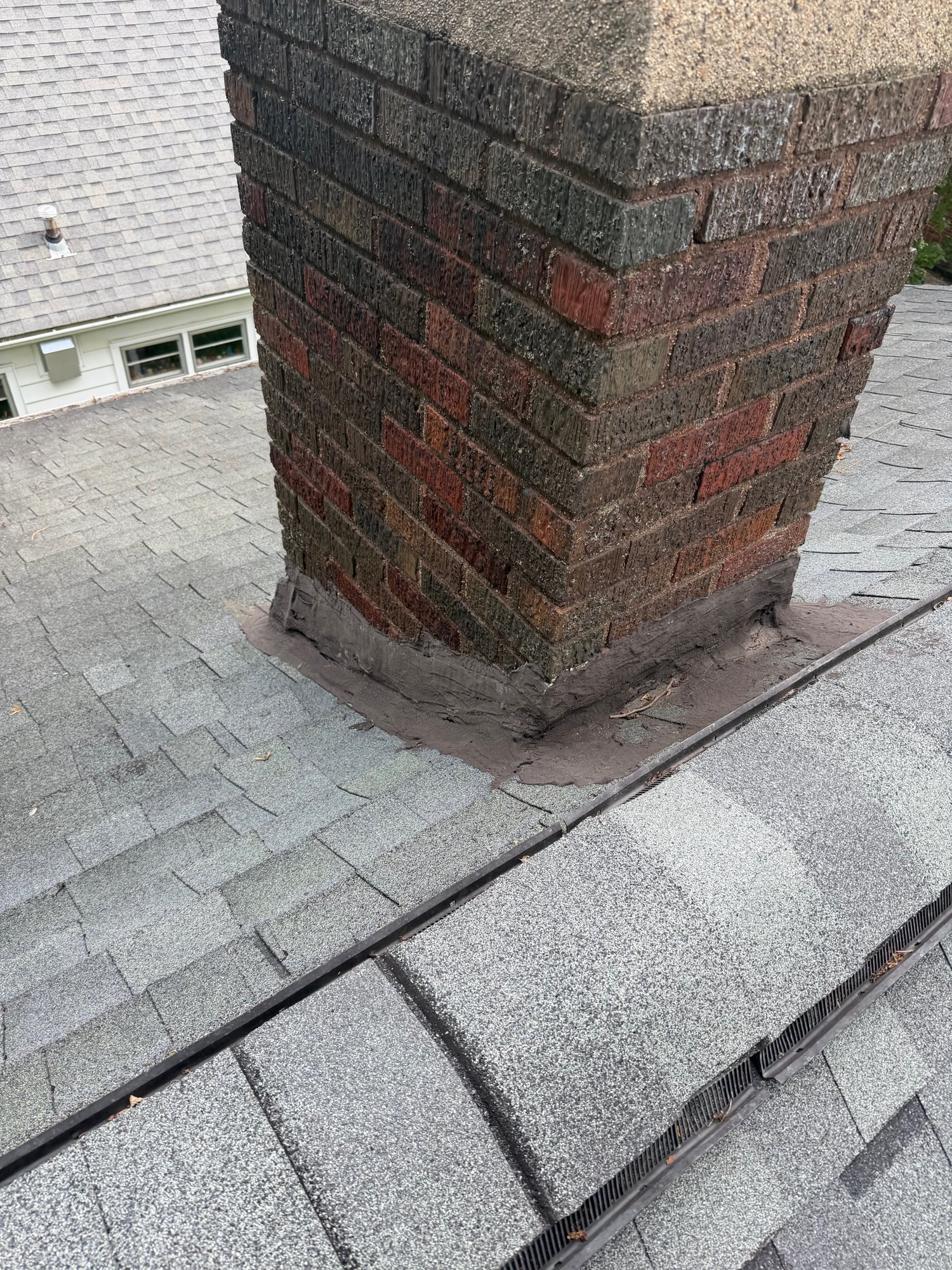 Failing chimney flashing before repair by Impact Exteriors