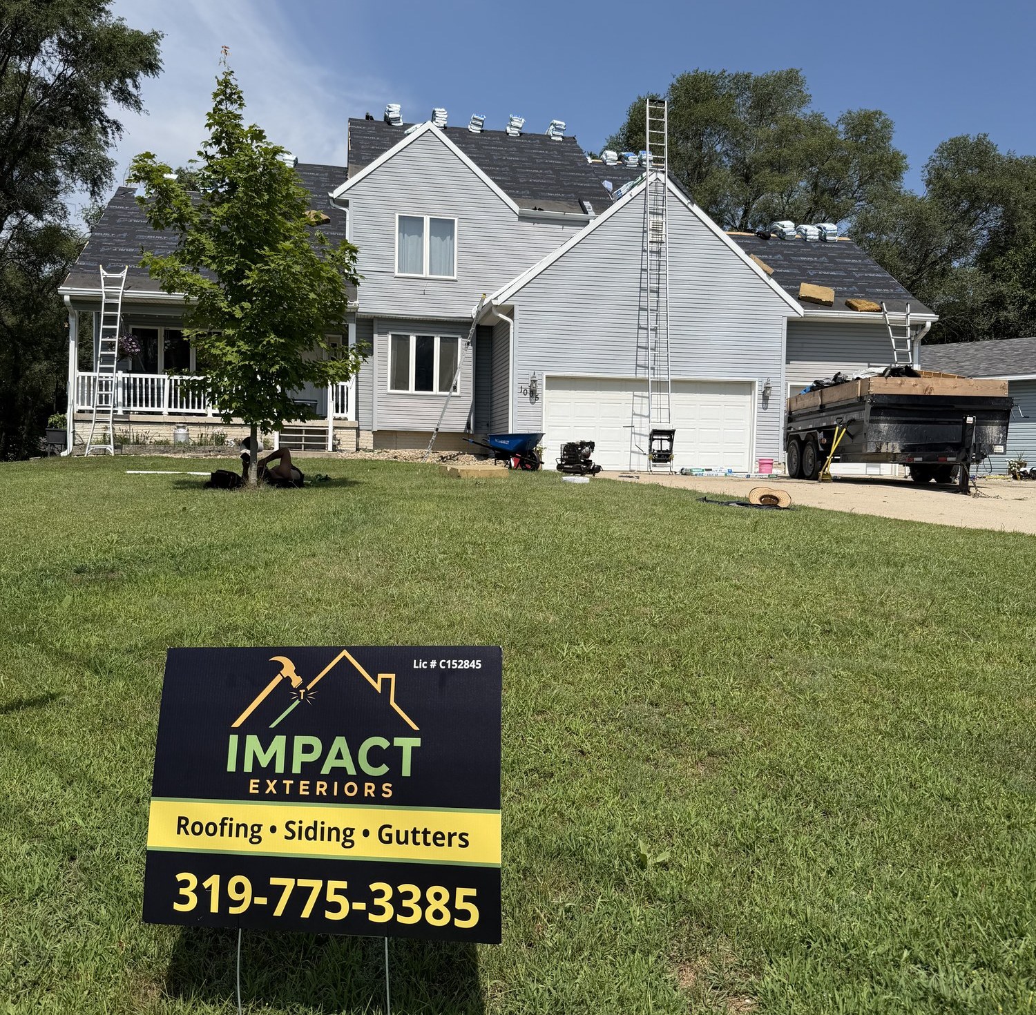 Impact Exteriors crew replacing a roof in Eastern Iowa