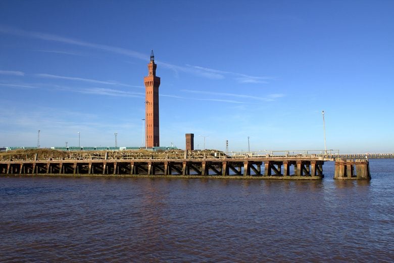 Grimsby Dock Tower beside the Humber estuary under a blue sky