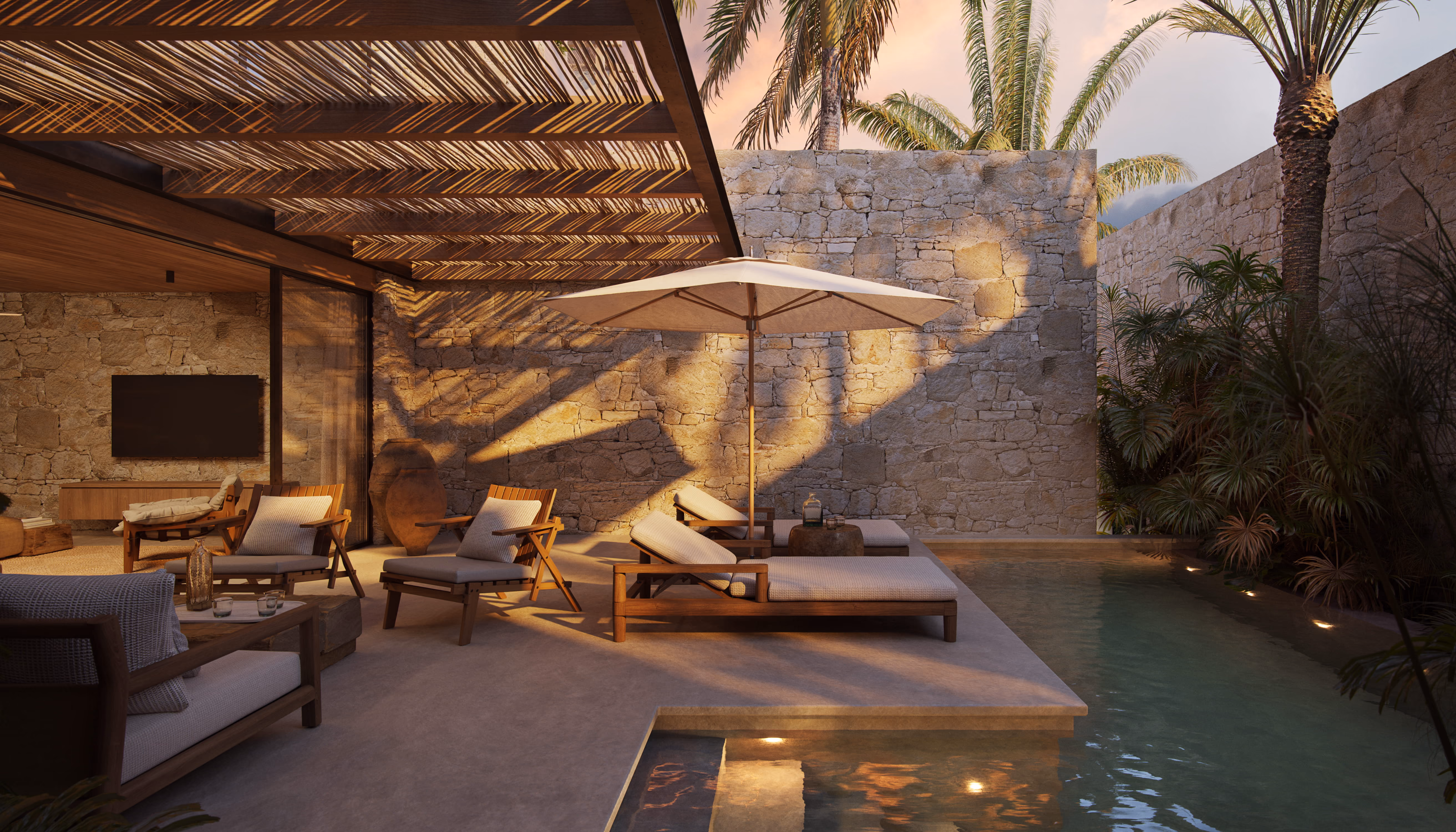 Villa Aruna pool area with outdoor seating in the evening