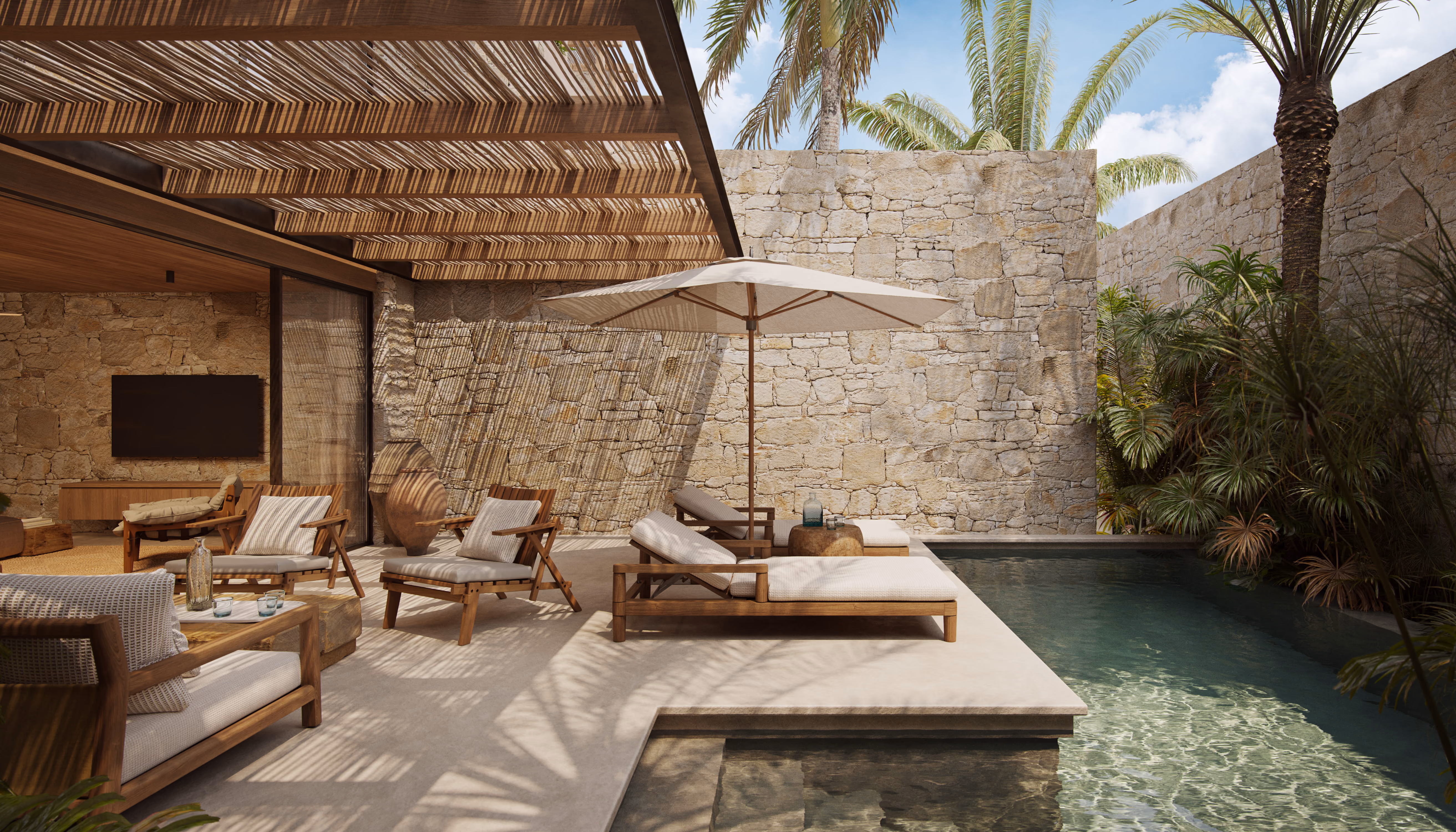 Villa Aruna poolside lounge area with sun loungers