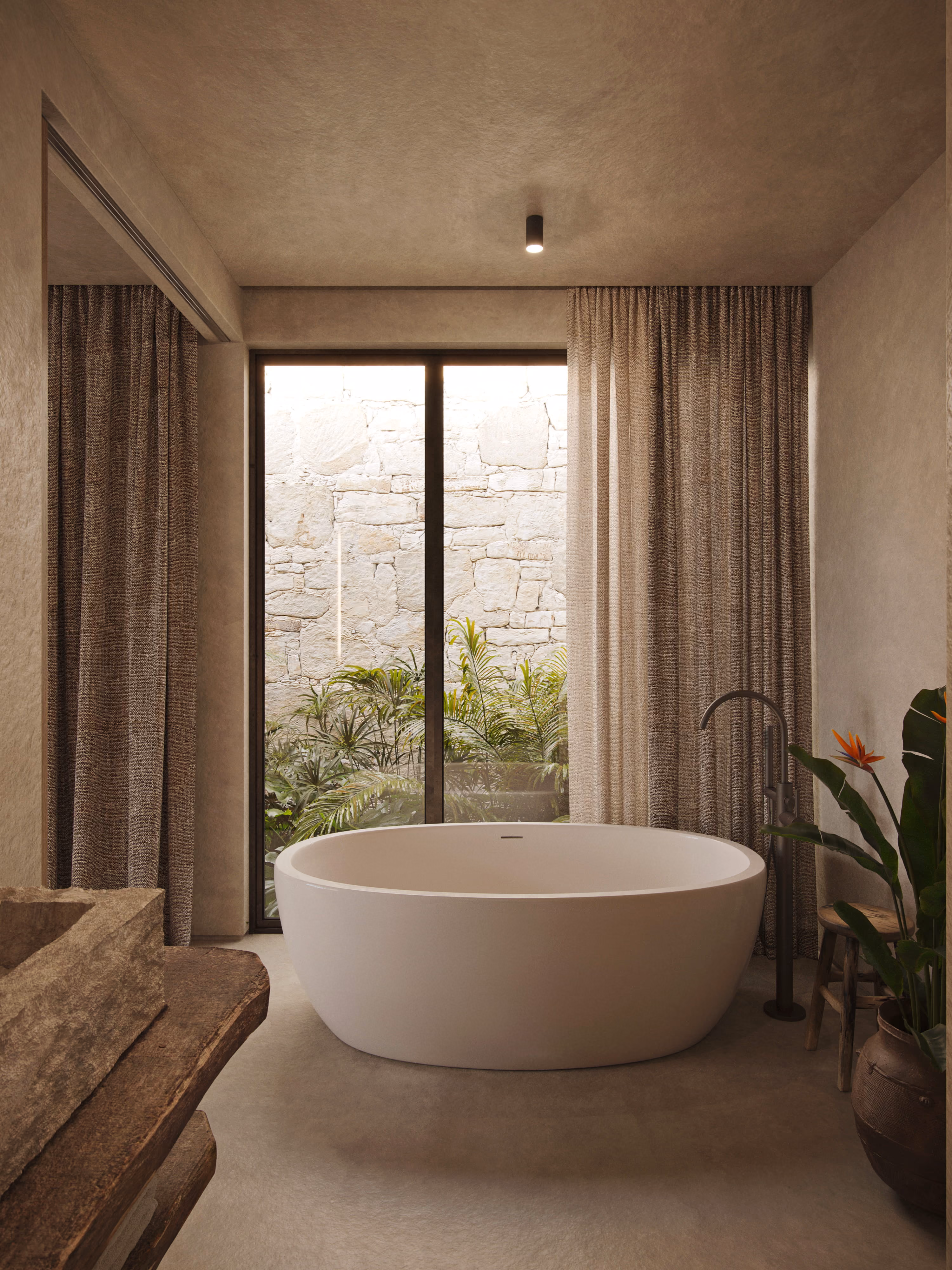 Villa Muara bathroom with freestanding tub and garden view