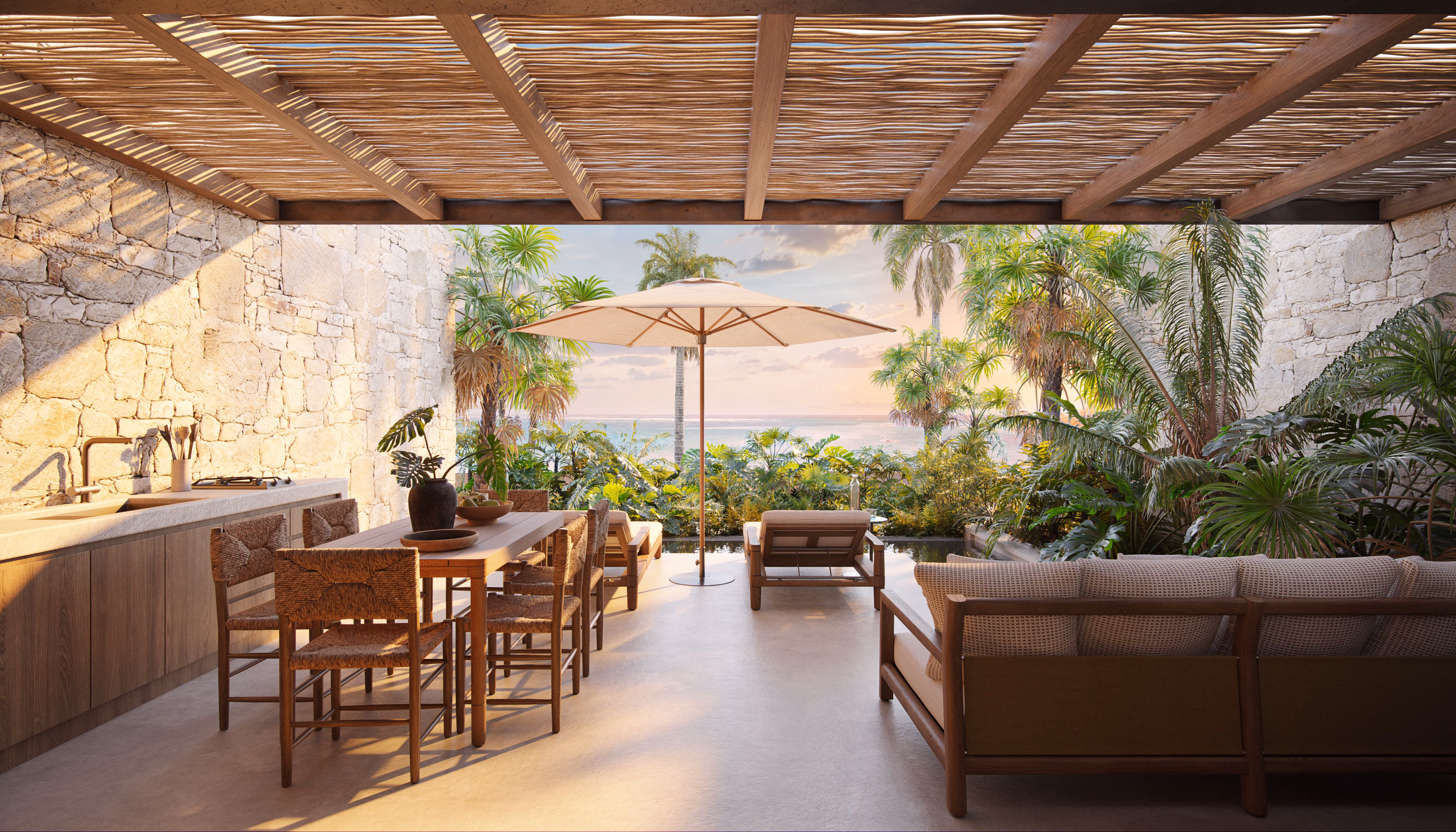 Outdoor dining and lounge area with sea view at Laga Living villa