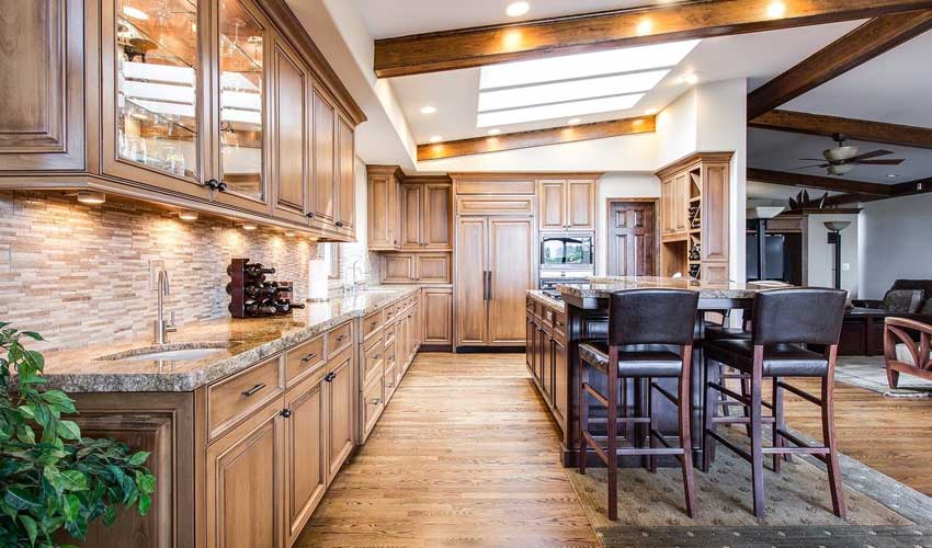 Warm wood kitchen with hardwood floors and custom cabinetry