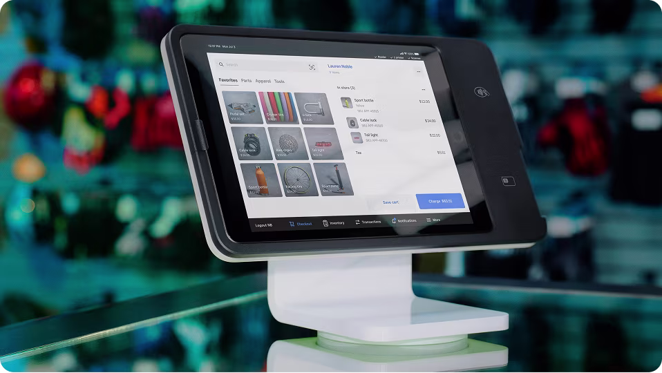 Modern point-of-sale touchscreen device displaying product selection and checkout options.