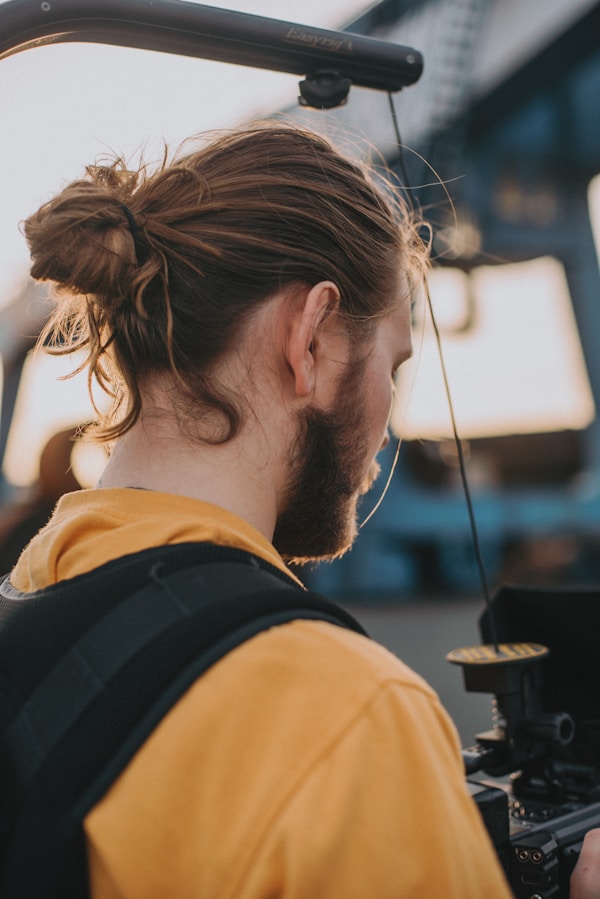 man in yellow and black shirt