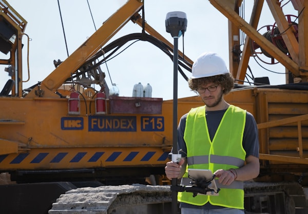 Land surveyor on construction site