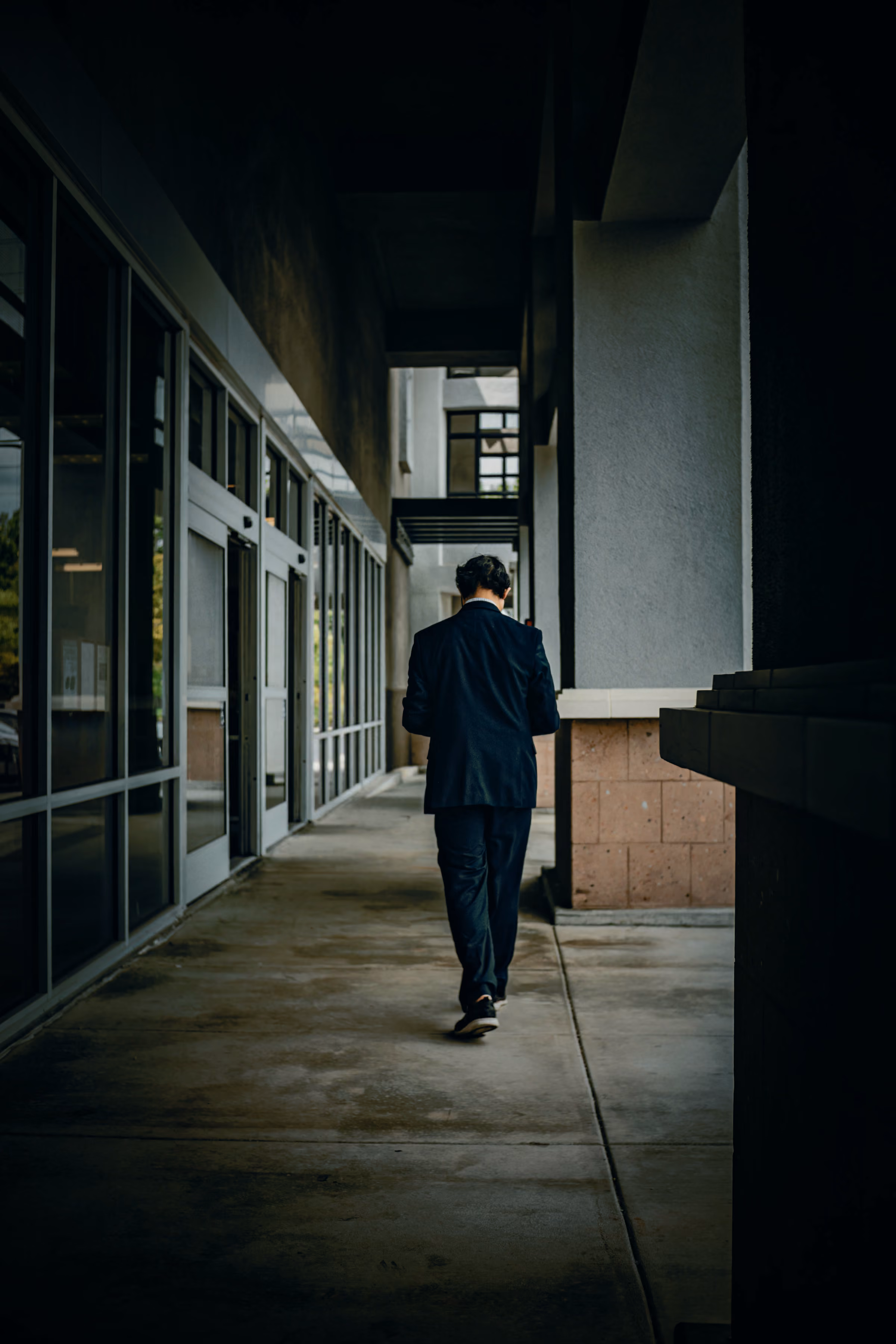 People walking through an office corridor