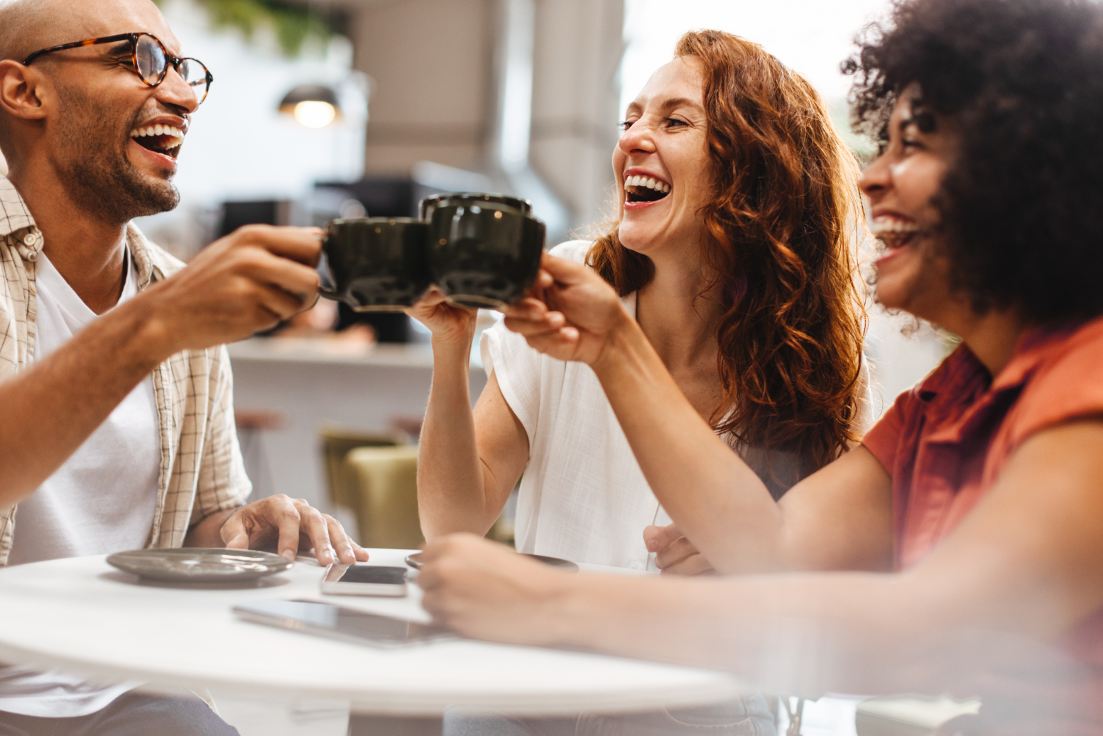 Friends cheering drinks stock image