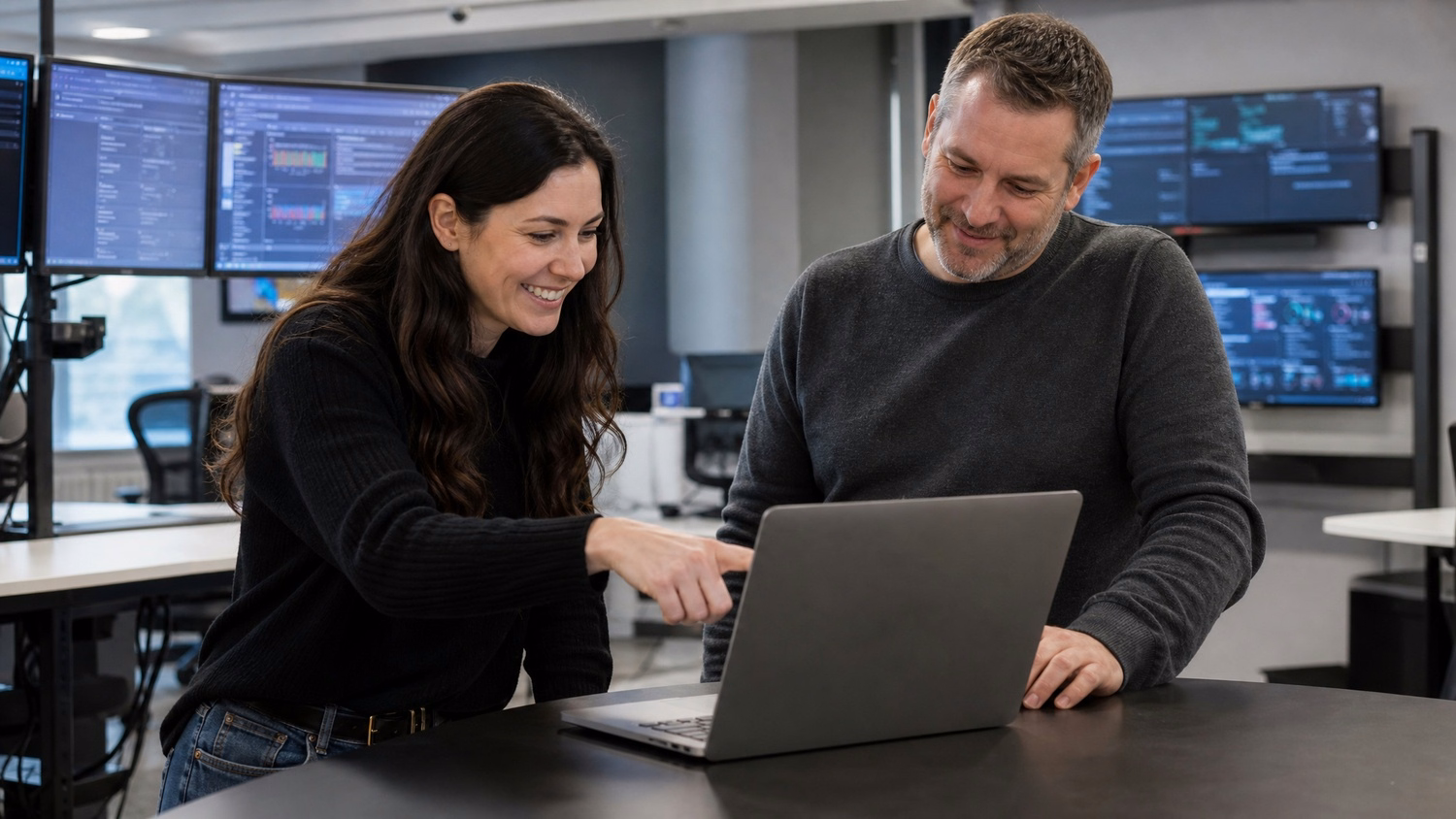 Analysts review simulated phishing email on laptop screen