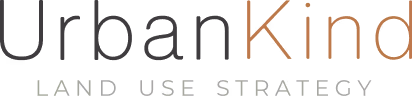 Text logo reading 'urbanKind' with 'urban' in dark gray and 'Kind' in brown.