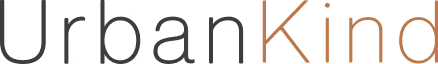 Black and orange text reading 'UrbanKind' with capital U and K on a white background.