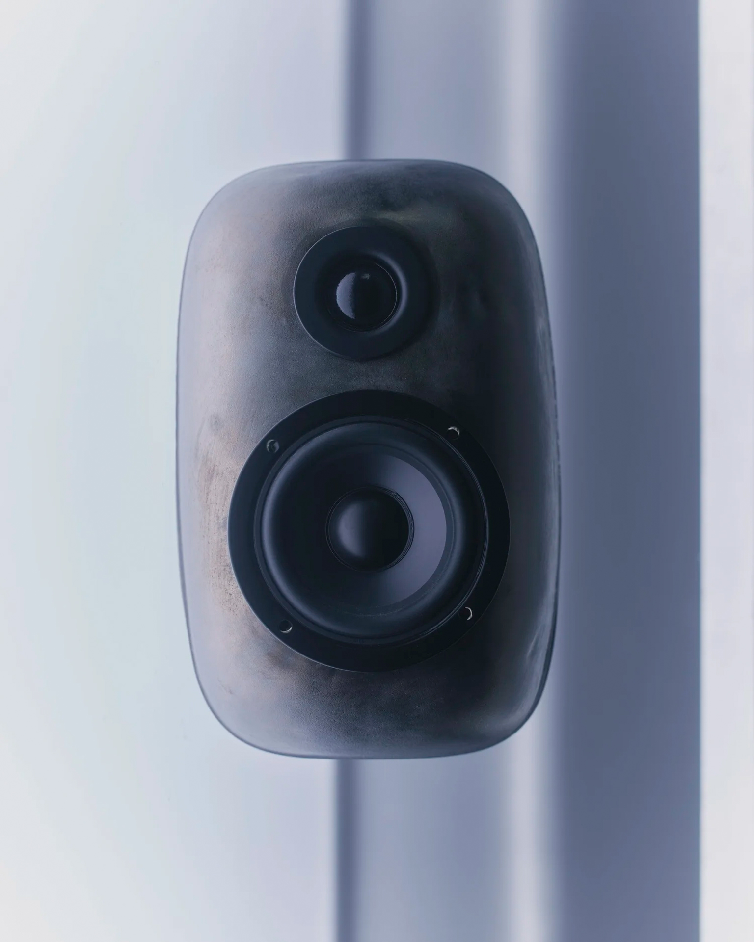 Front view of a handcrafted cast bookshelf speaker by MYCO AUDIO