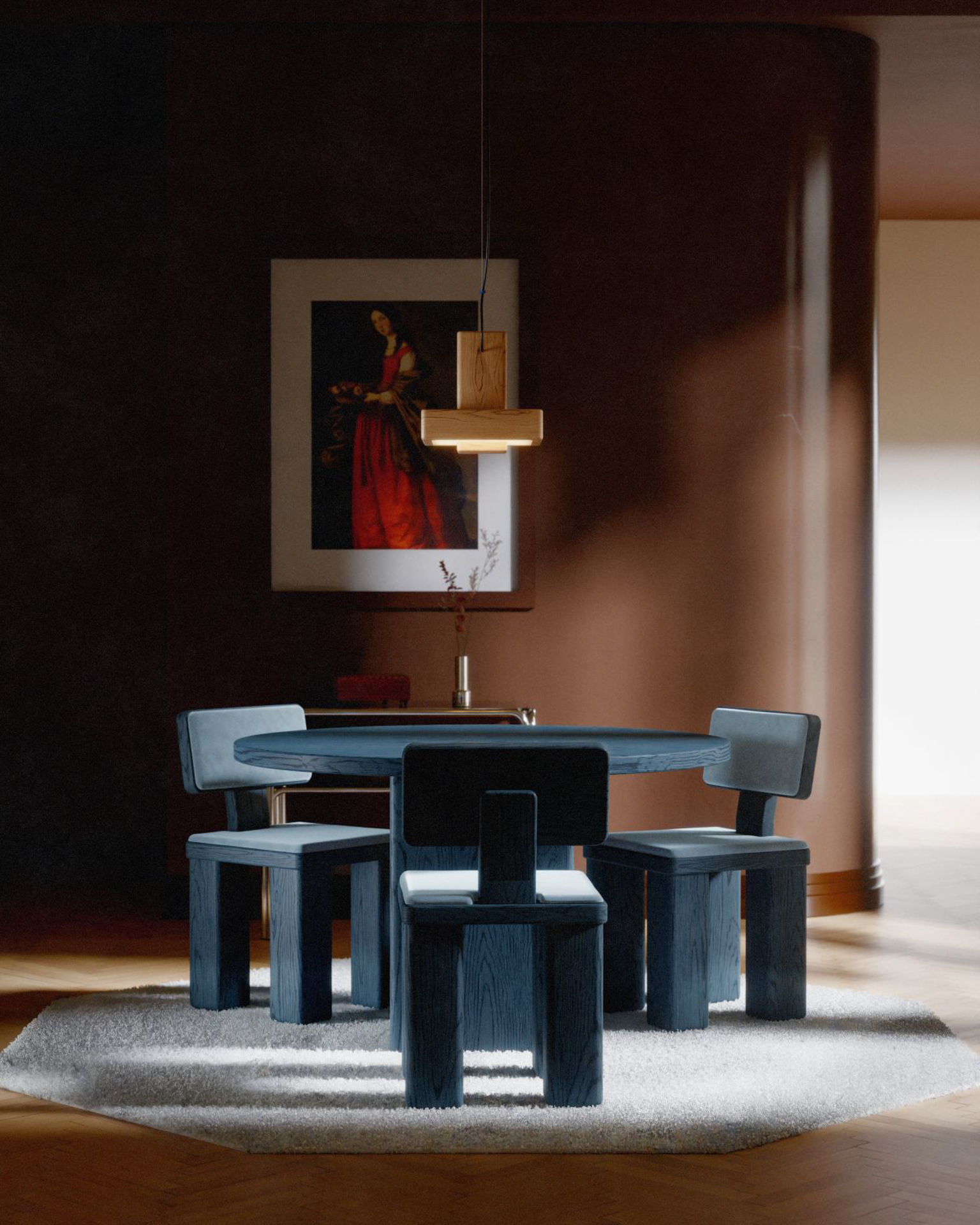 Blue oak dining set by Studio Super Sunday beneath a classical portrait and wood pendant light