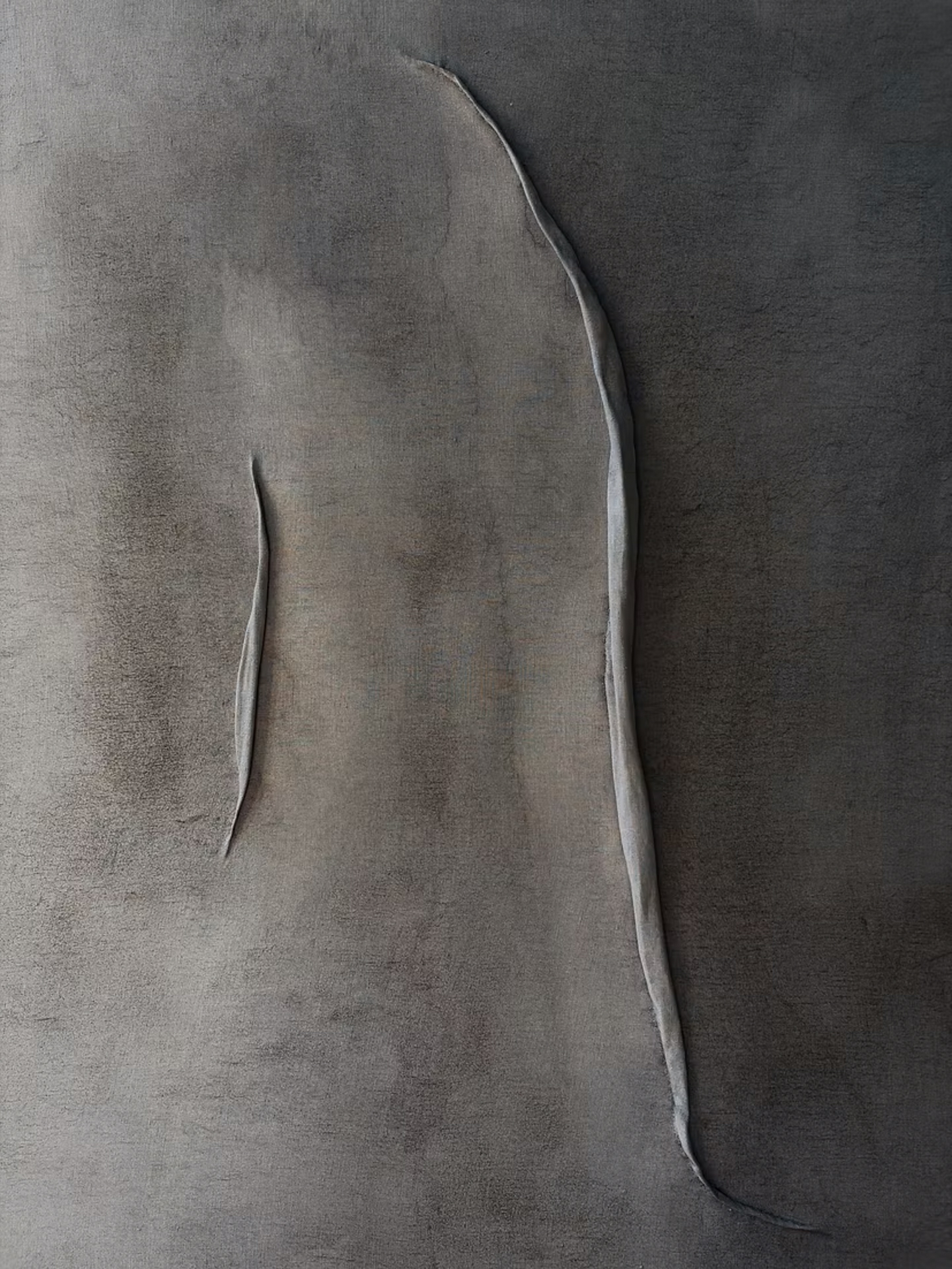 Detail of a grey textile wall artwork with raised linear forms by Felix Paquet