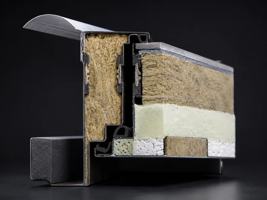 Cross-section of an EU-certified insulated steel door showing frame, seals, and core materials.