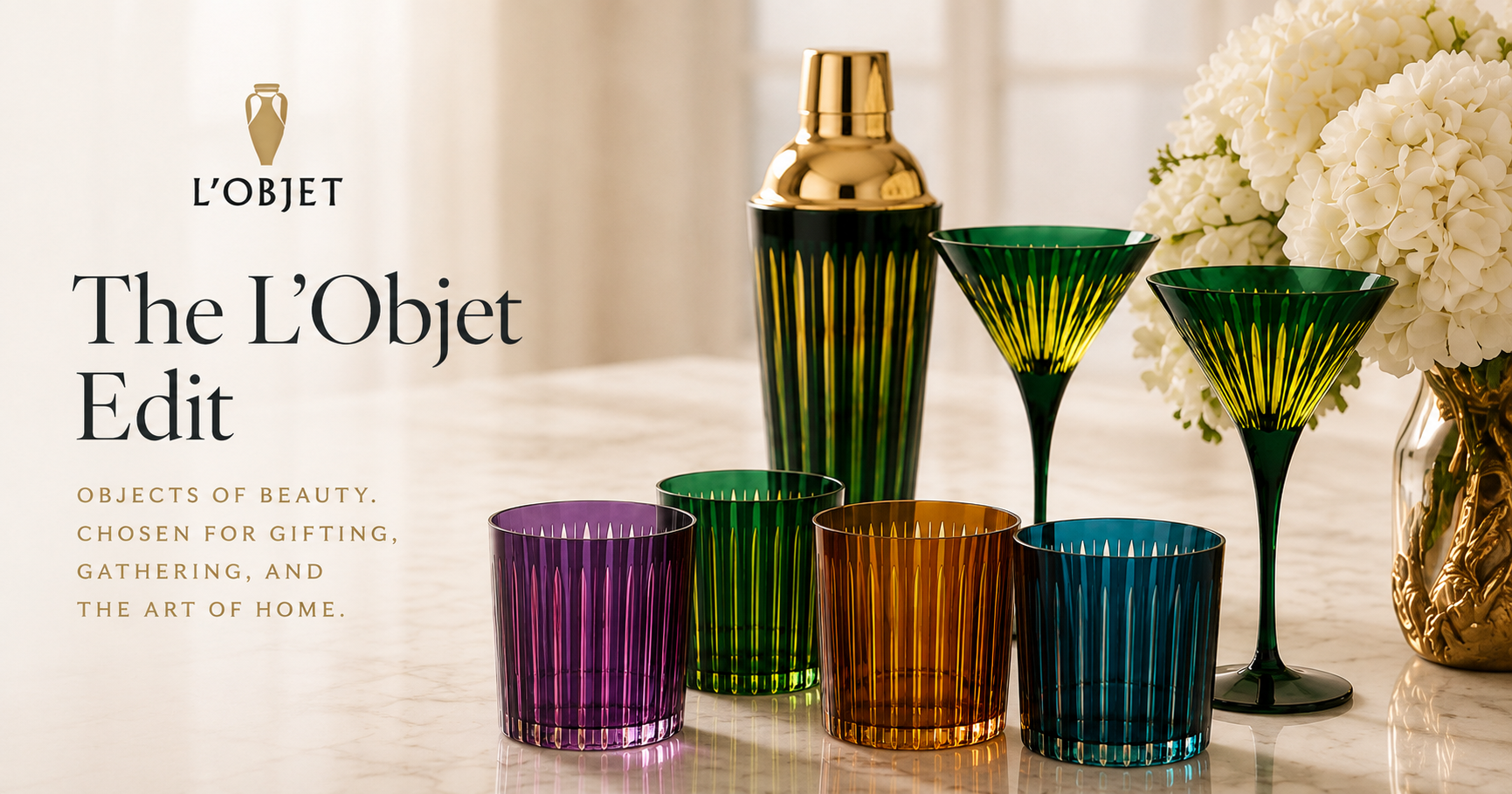 Colorful L'Objet glassware and gold-topped cocktail shaker