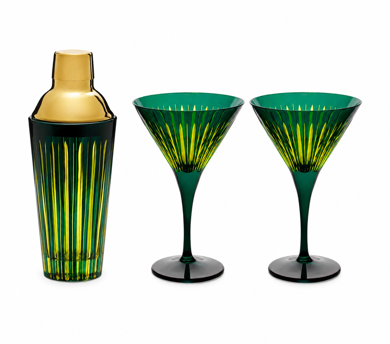 Green glass cocktail shaker with gold top and two matching green martini glasses.