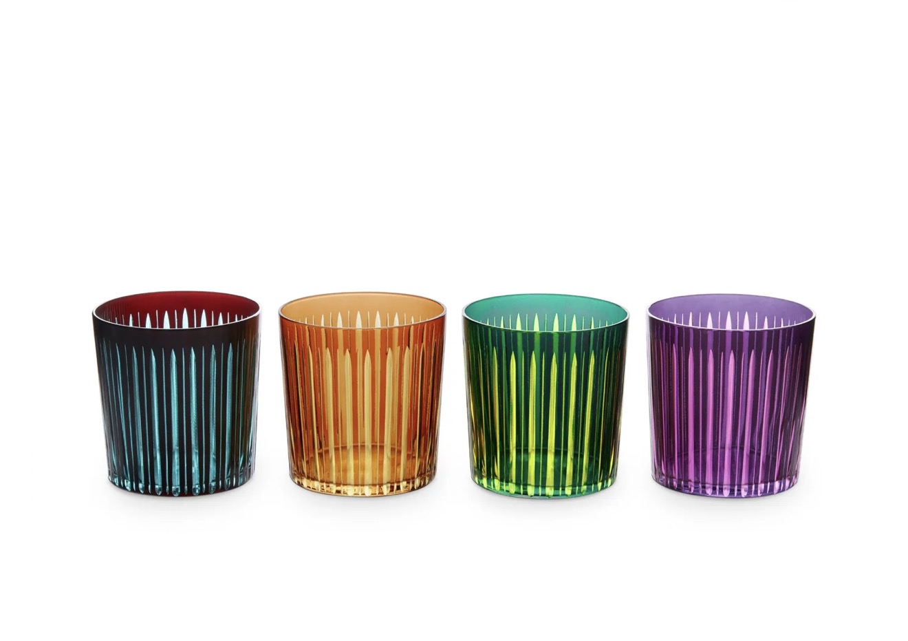 Four colorful ribbed glass tumblers in blue, amber, green, and purple on a white background.