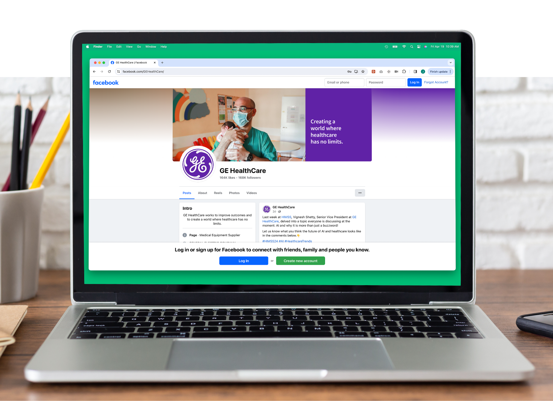 GE HealthCare social media page shown on a laptop