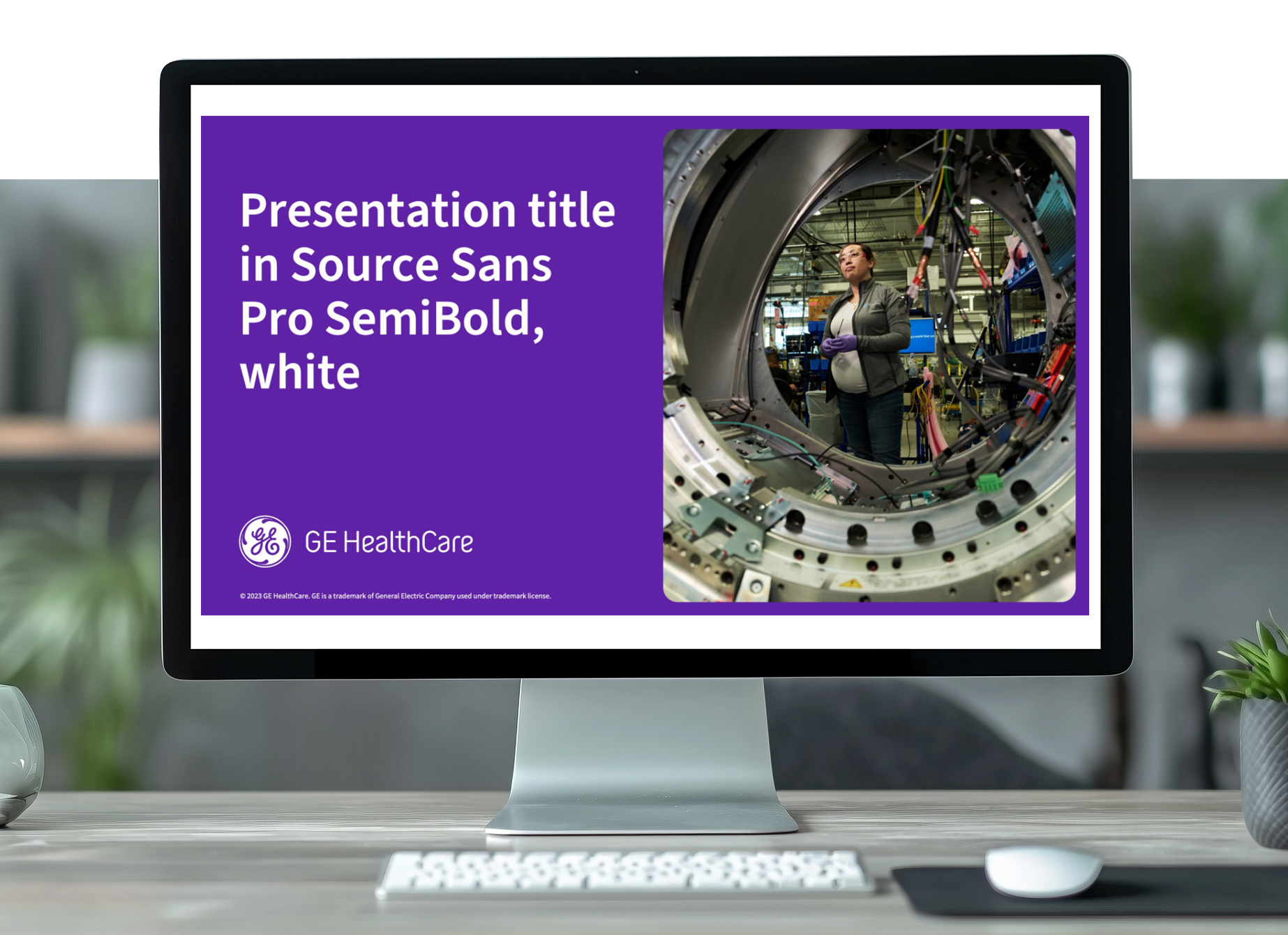 GE HealthCare presentation title slide on a desktop monitor