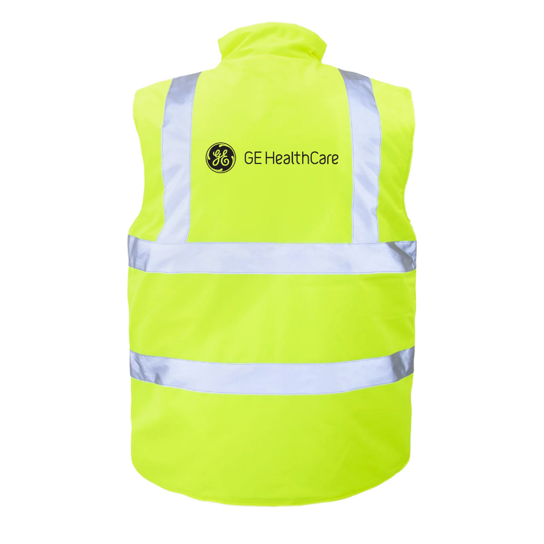 High-visibility yellow GE HealthCare safety vest