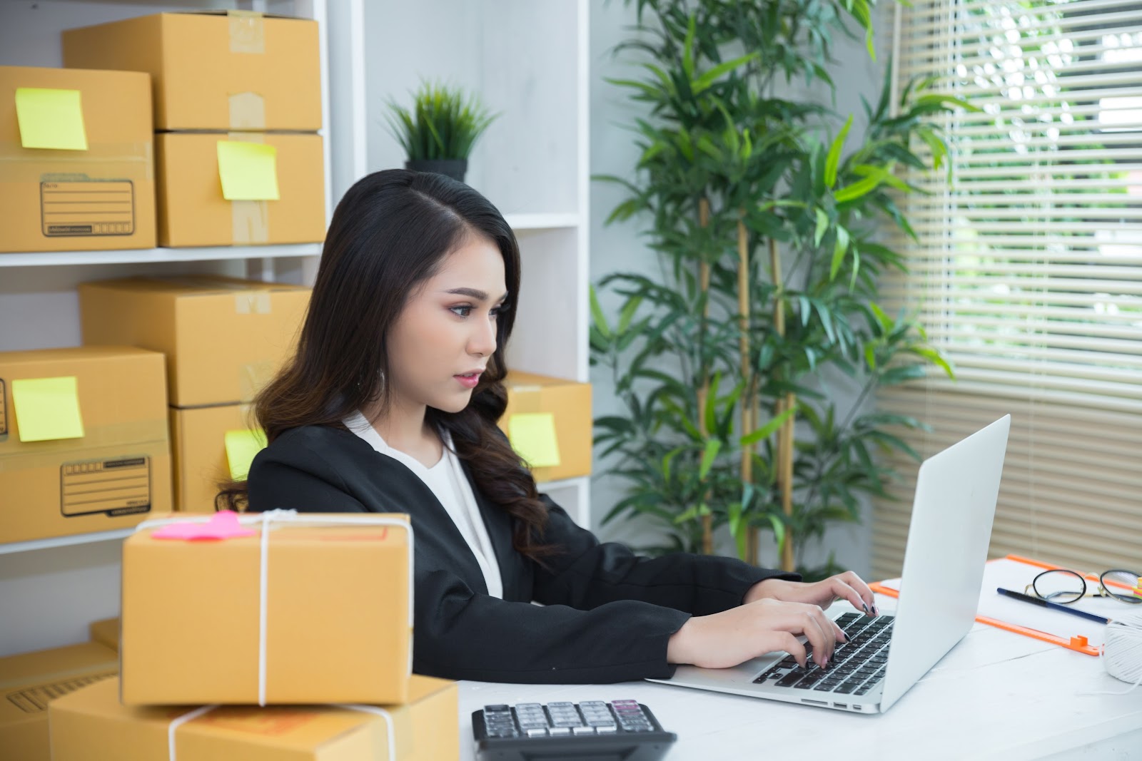 Woman in an office using a laptop