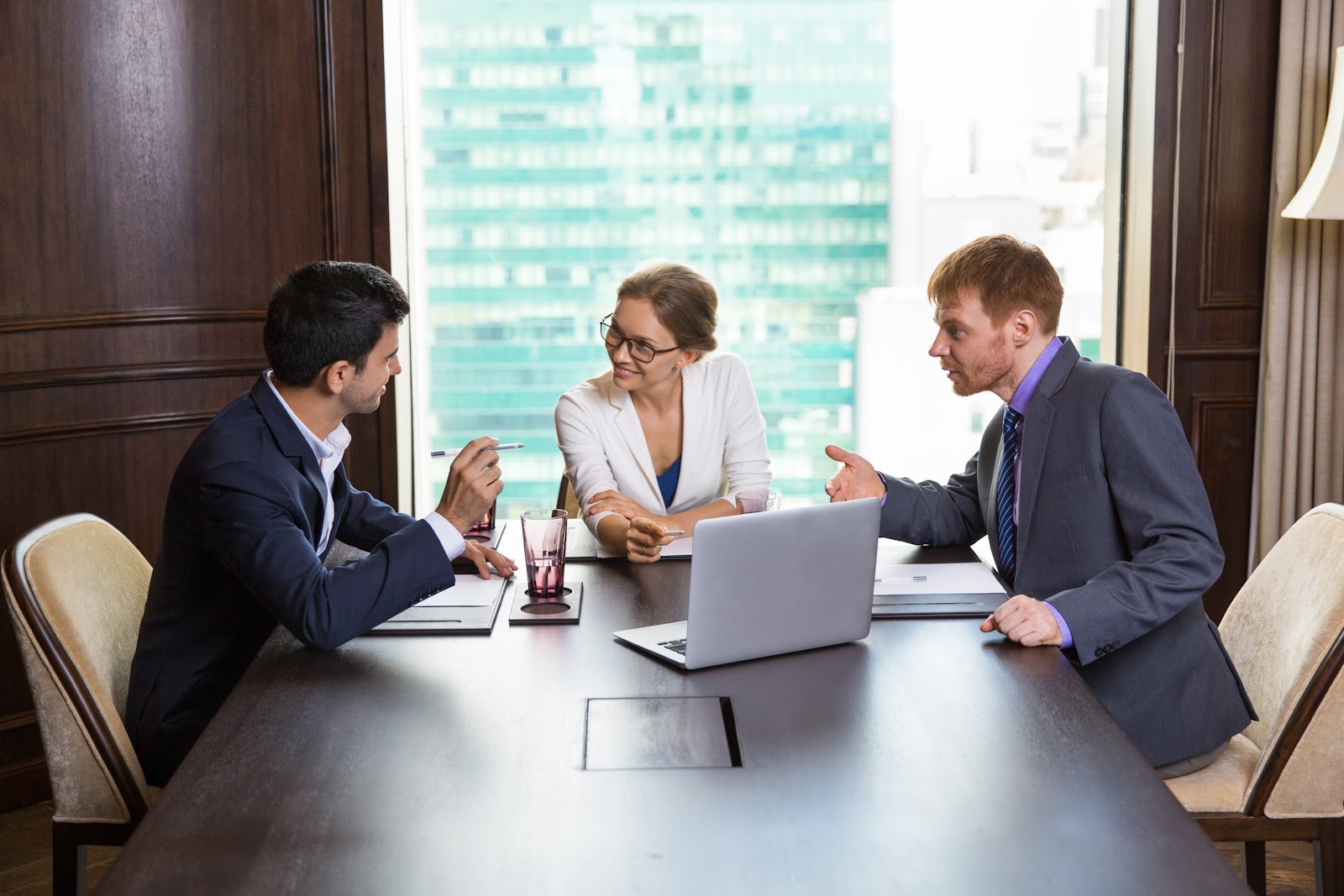 Businesspeople analyzing a report in a meeting