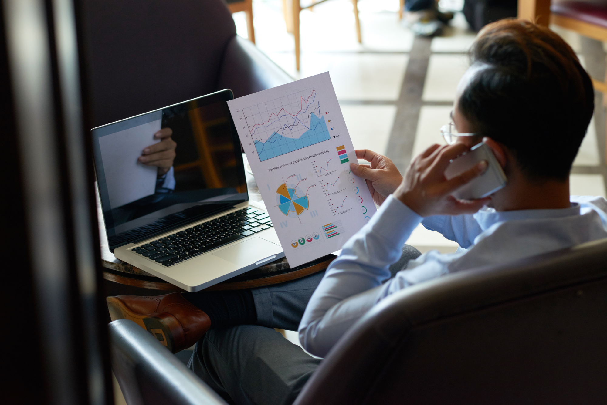man looking at charts