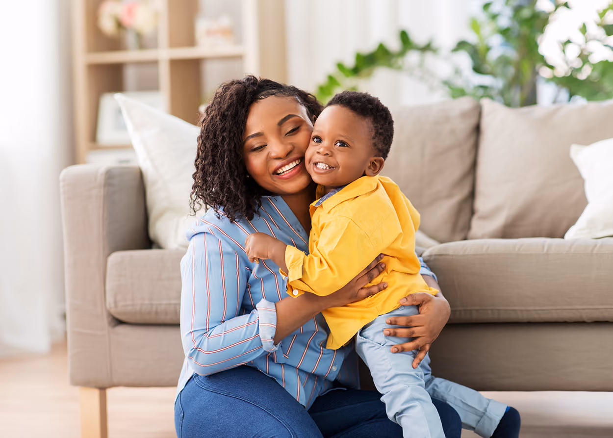Mother and son hugging. Attachment theory by Aaron Helm Therapy