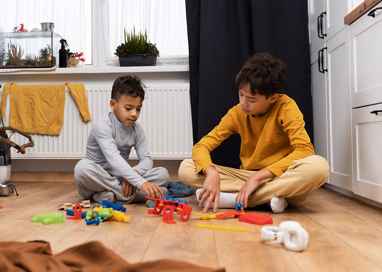 Child engaged in child-centered play therapy with toys in a warm therapy room