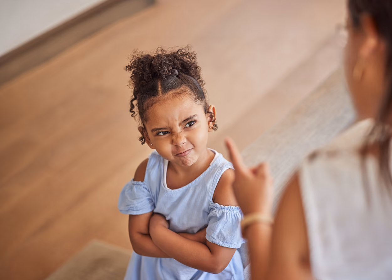 Young child working through emotions with toys during a behavioral play therapy session