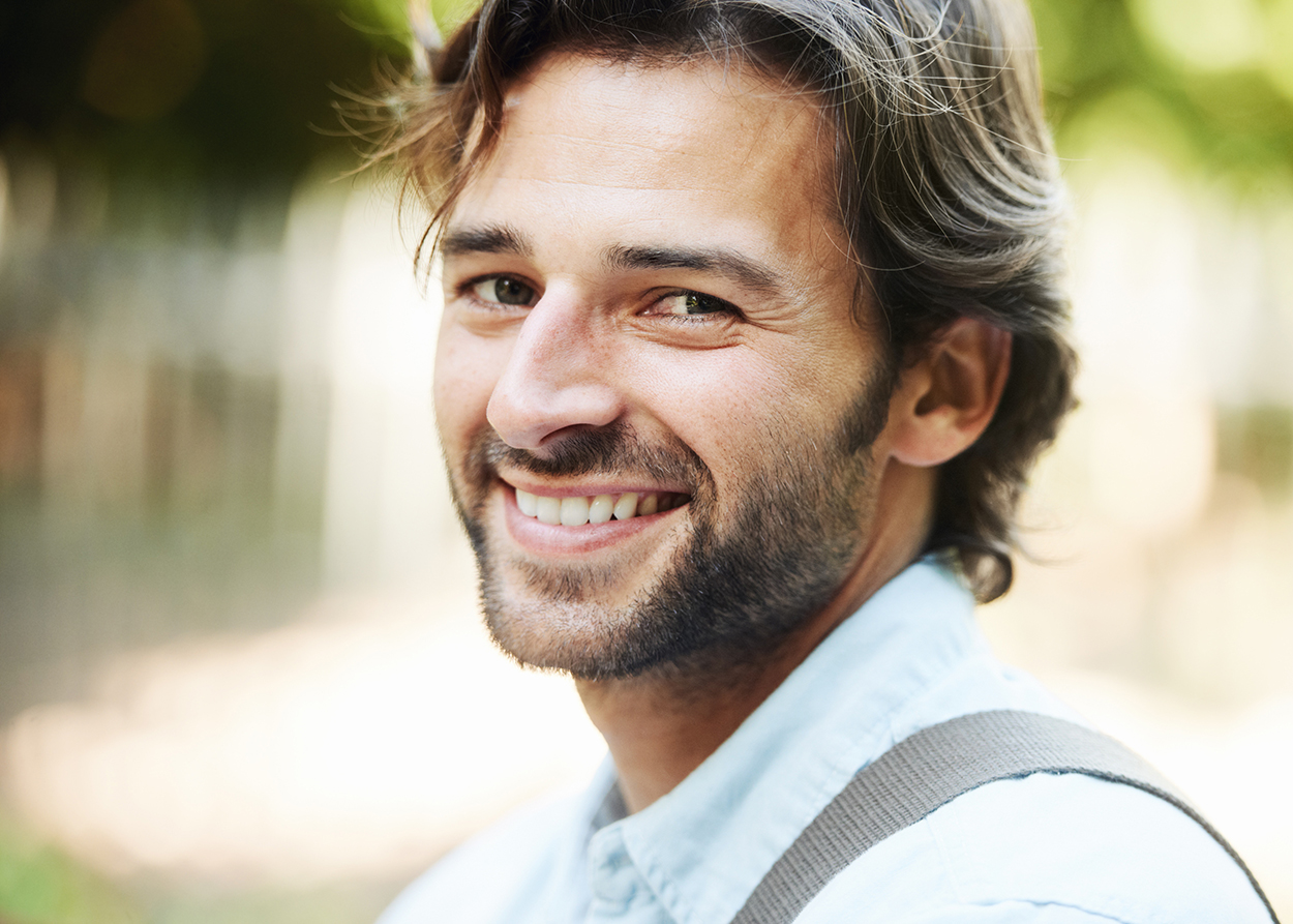 Portrait of a man smiling at camera. Therapy with Aaron Helm