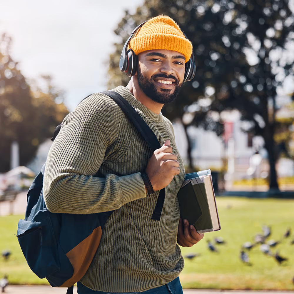 black college age male walking to class. Therapy for college students in plano texas.