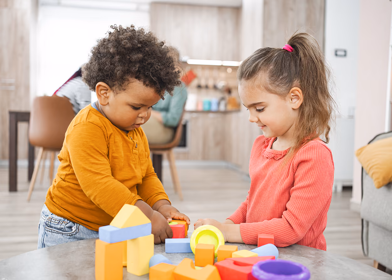 Child playing with toys in a play therapy room. What is play therapy, a guide for Plano parents from Aaron Helm