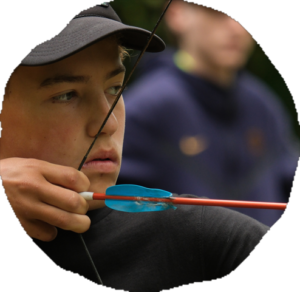 Camper practicing archery on the range