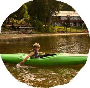 Campers kayaking near the Kilcoo shoreline