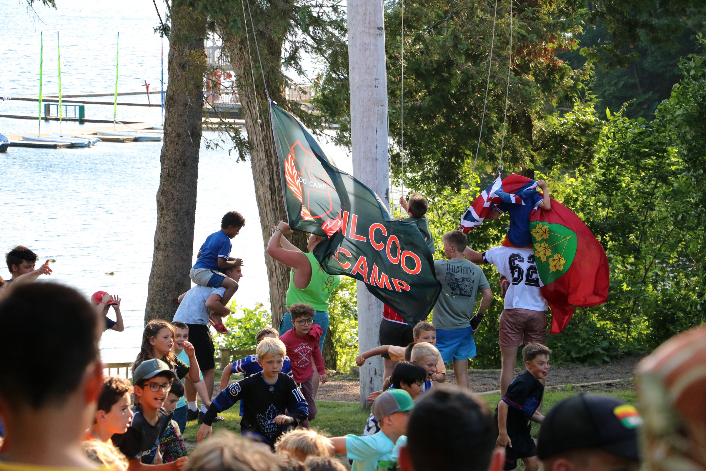 Kilcoo campers cheering at the flag raising by the waterfront