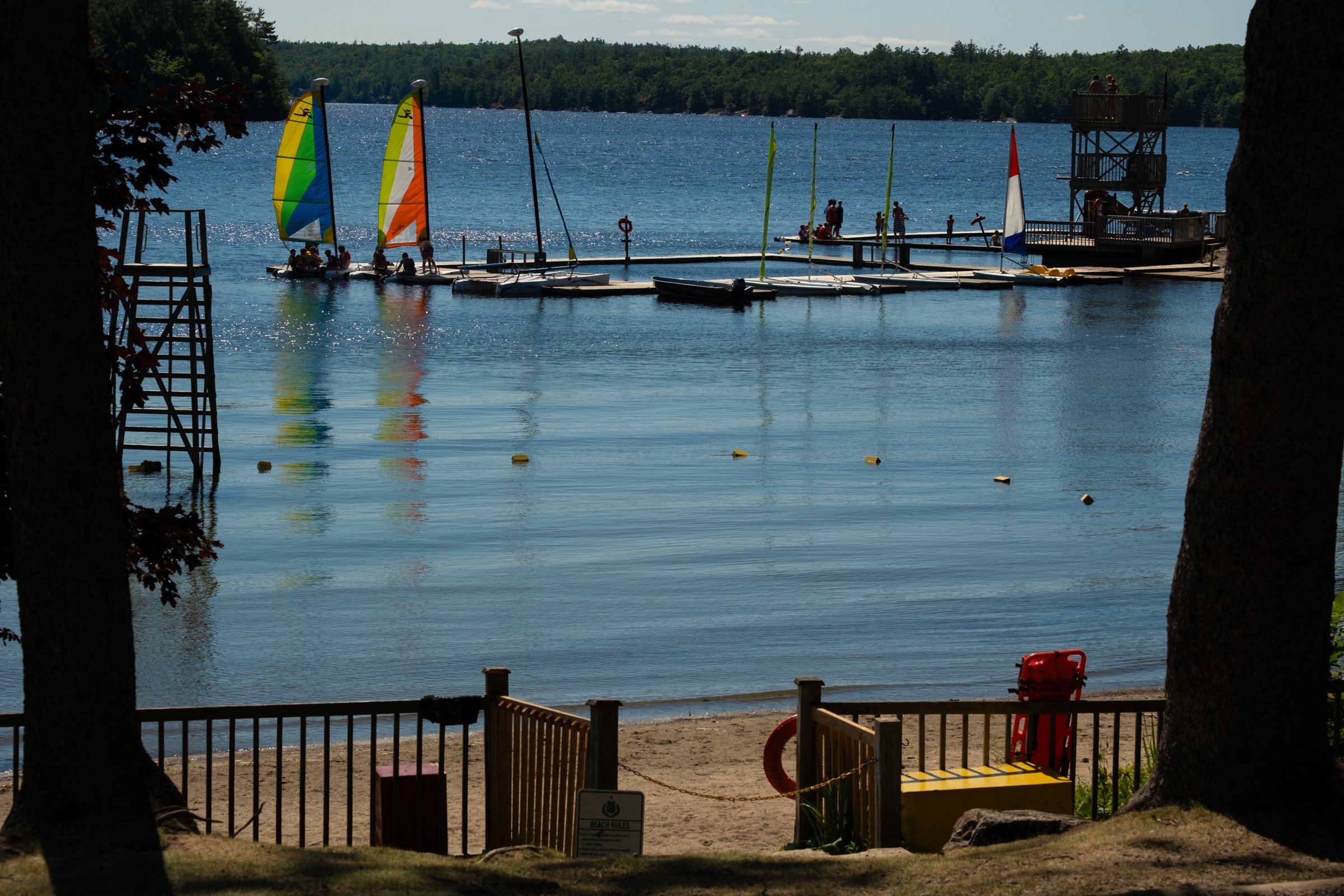 Sailboats at the Kilcoo docks on Gull Lake, seen from the beach