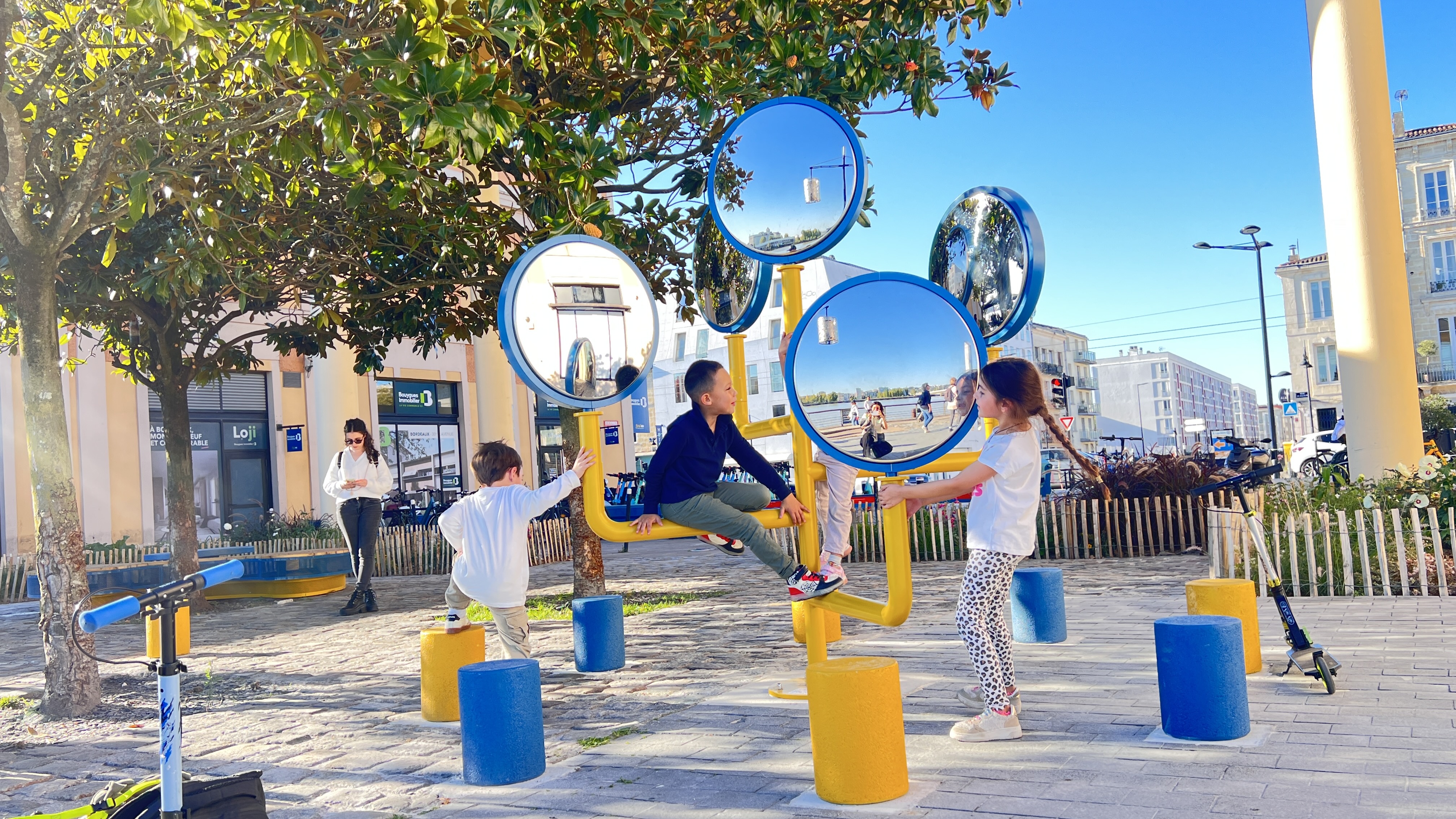 Designer drawing a bus-shaped play structure on a tablet