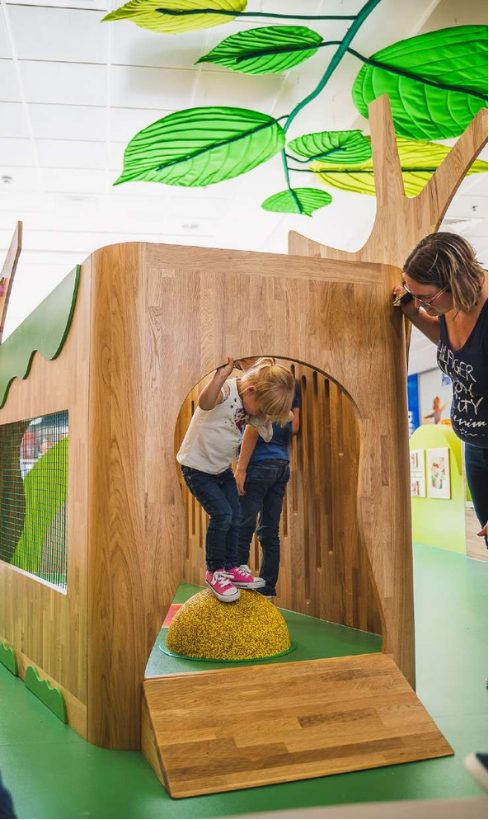 Play structure with a slide in a shopping centre