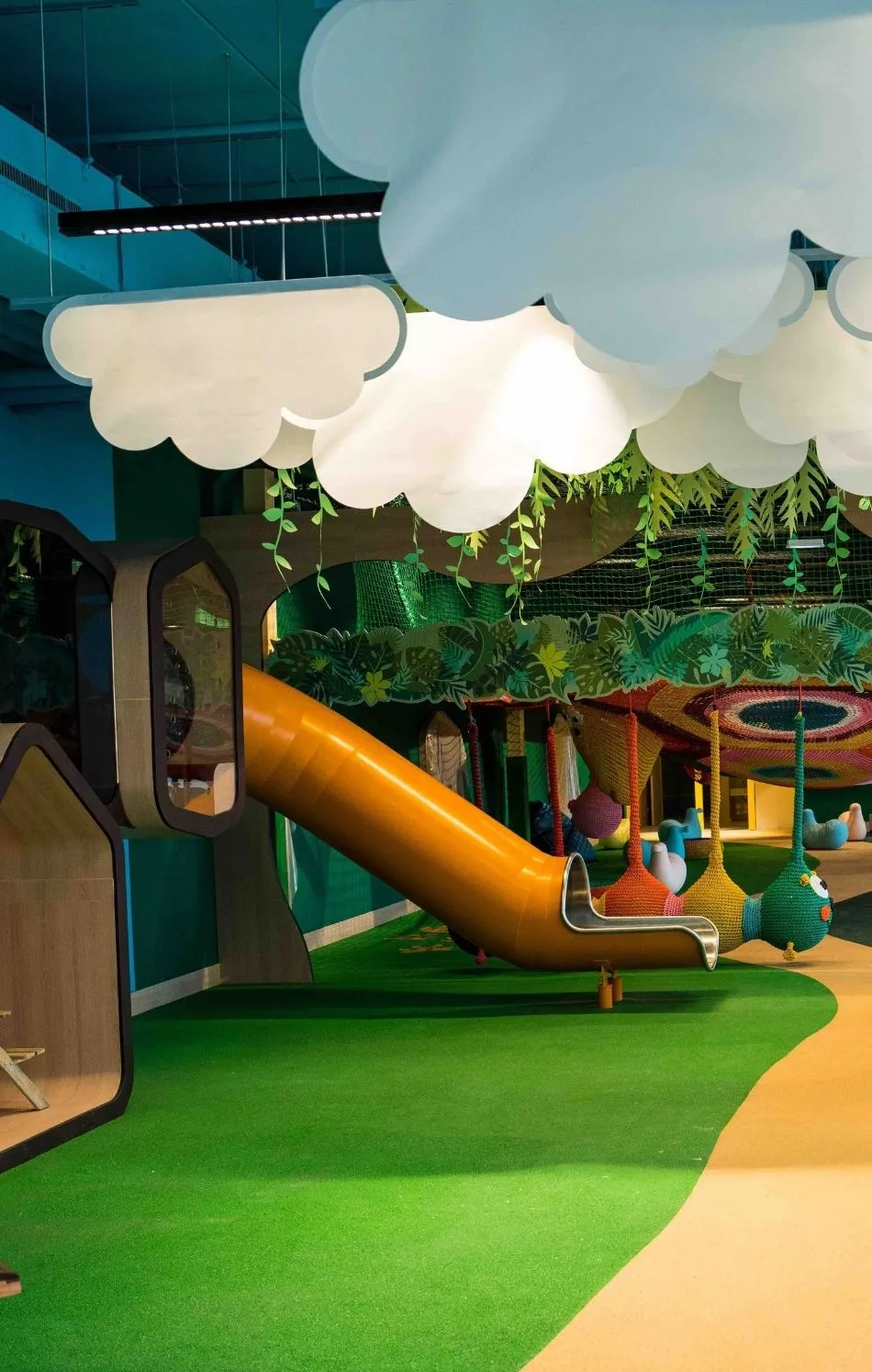 Children playing in a train station play space