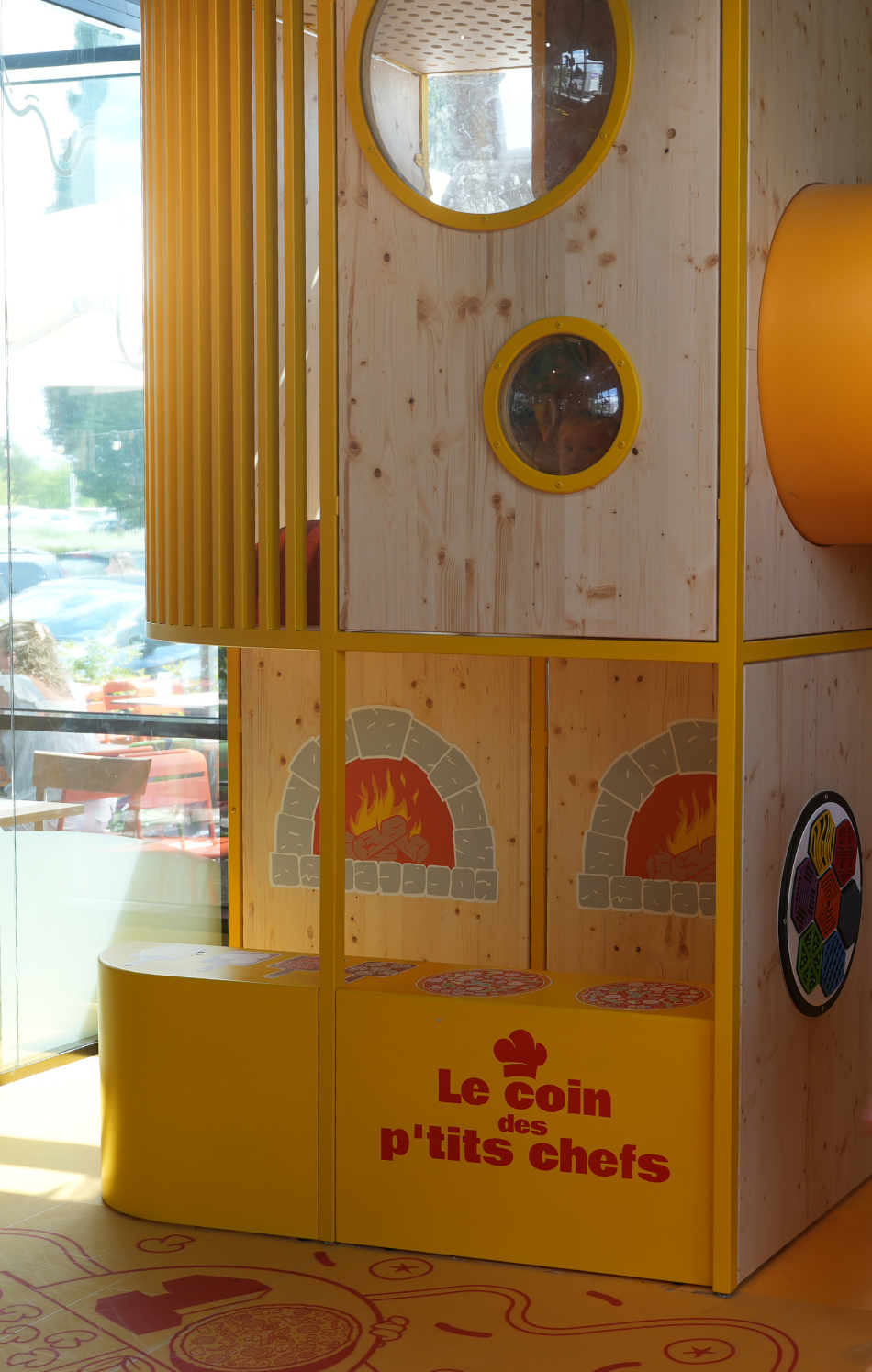 Play structure with a slide in a shopping centre