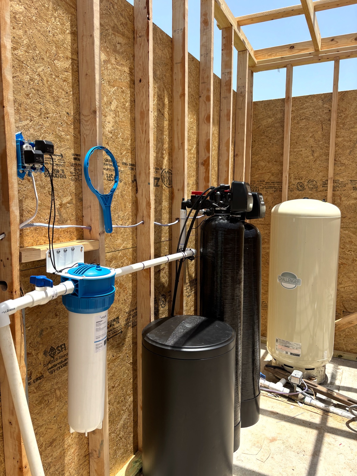 Whole-home water filtration and softener system in a Central Texas home