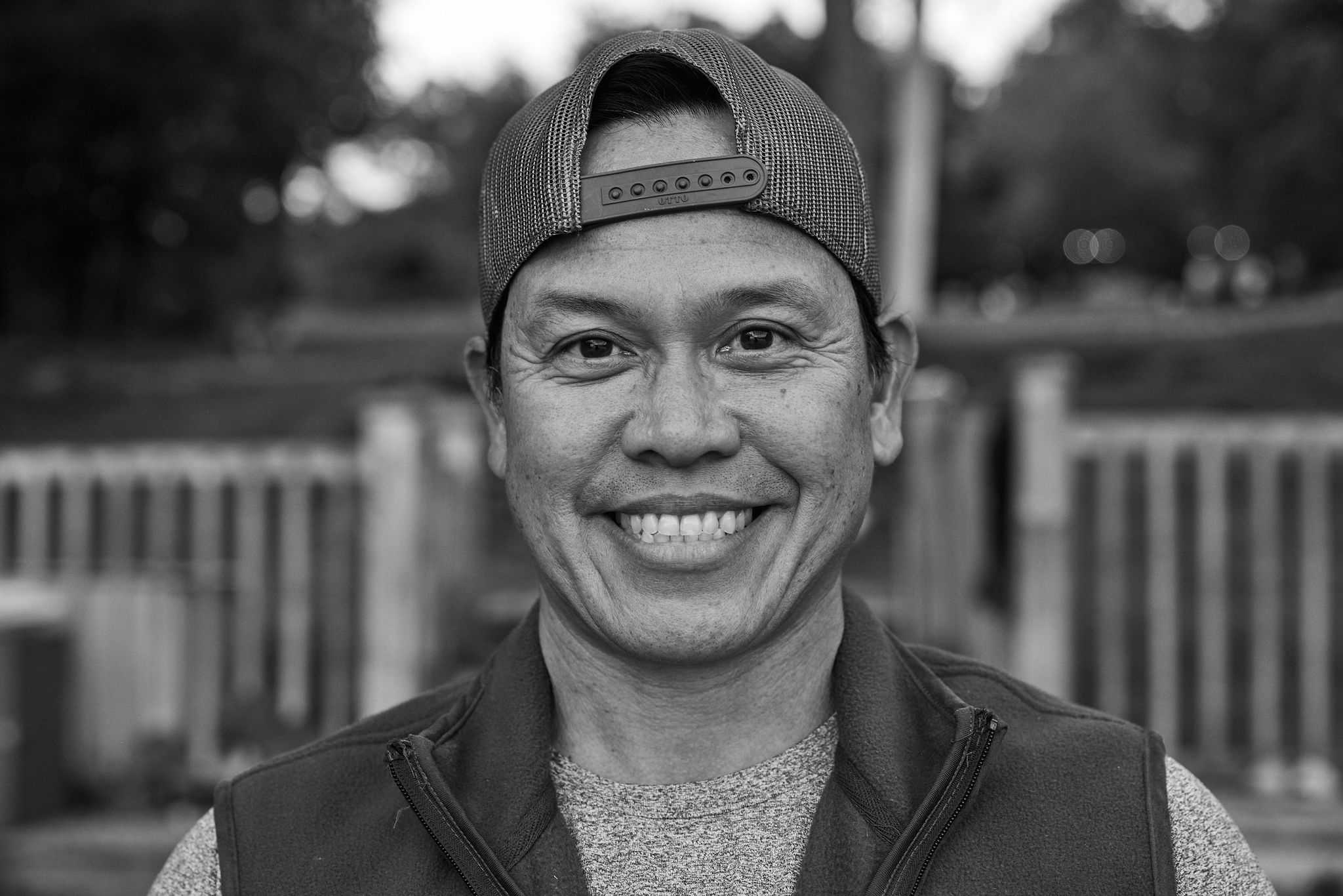 Aldrin Primaylon, known at camp as Buzz, Kilcoo Assistant Director, in a black and white portrait wearing a ball cap.