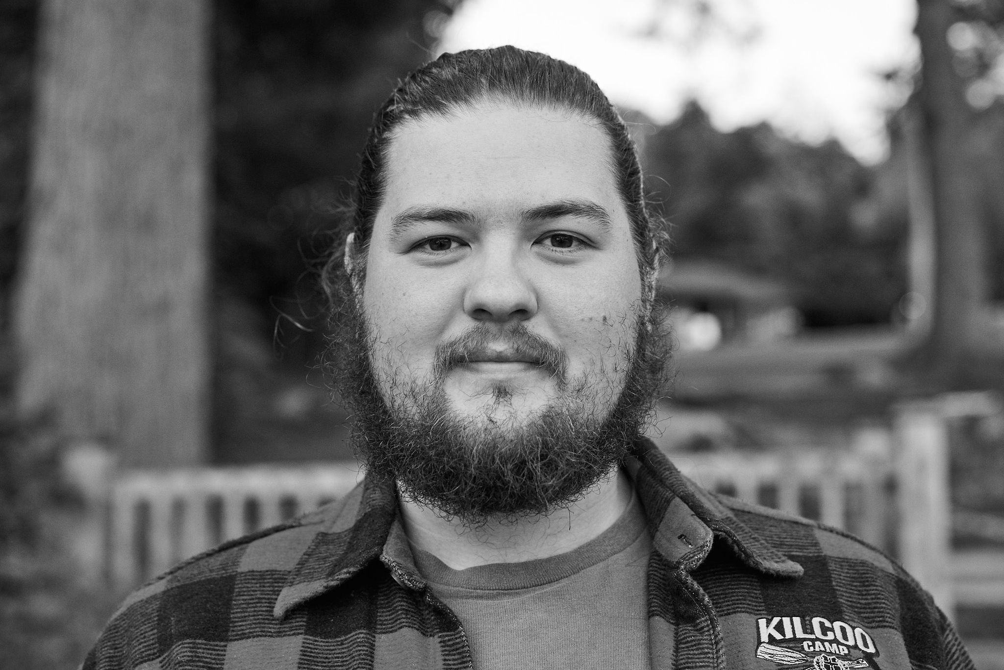 Stu Armstrong, Kilcoo Outdoor Education Director, in a black and white portrait wearing a Kilcoo shirt.