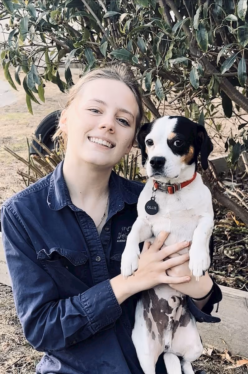 Tamika, Junior Veterinary Nurse at Western Victoria Vets, holding her dog
